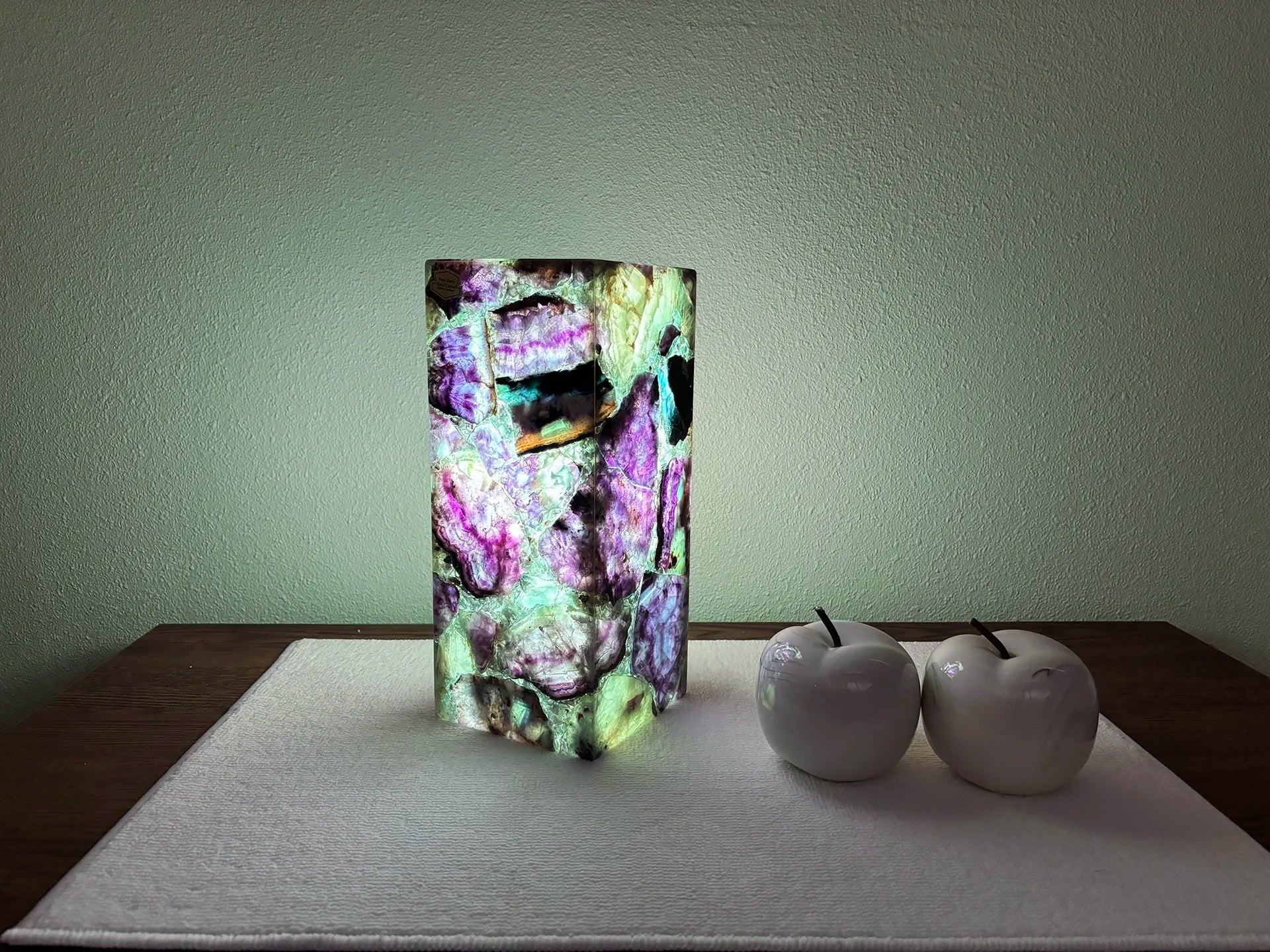 Fluorite table lamp lit with lots of purple and green tones