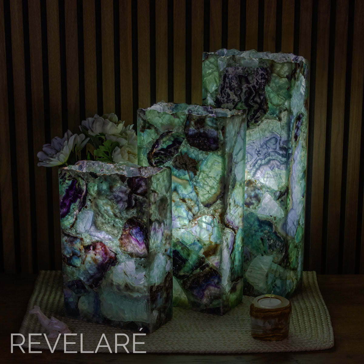 Fluorite rectangular live edge lamps as seen when lit in a dark environment. Comparison of available sizes.