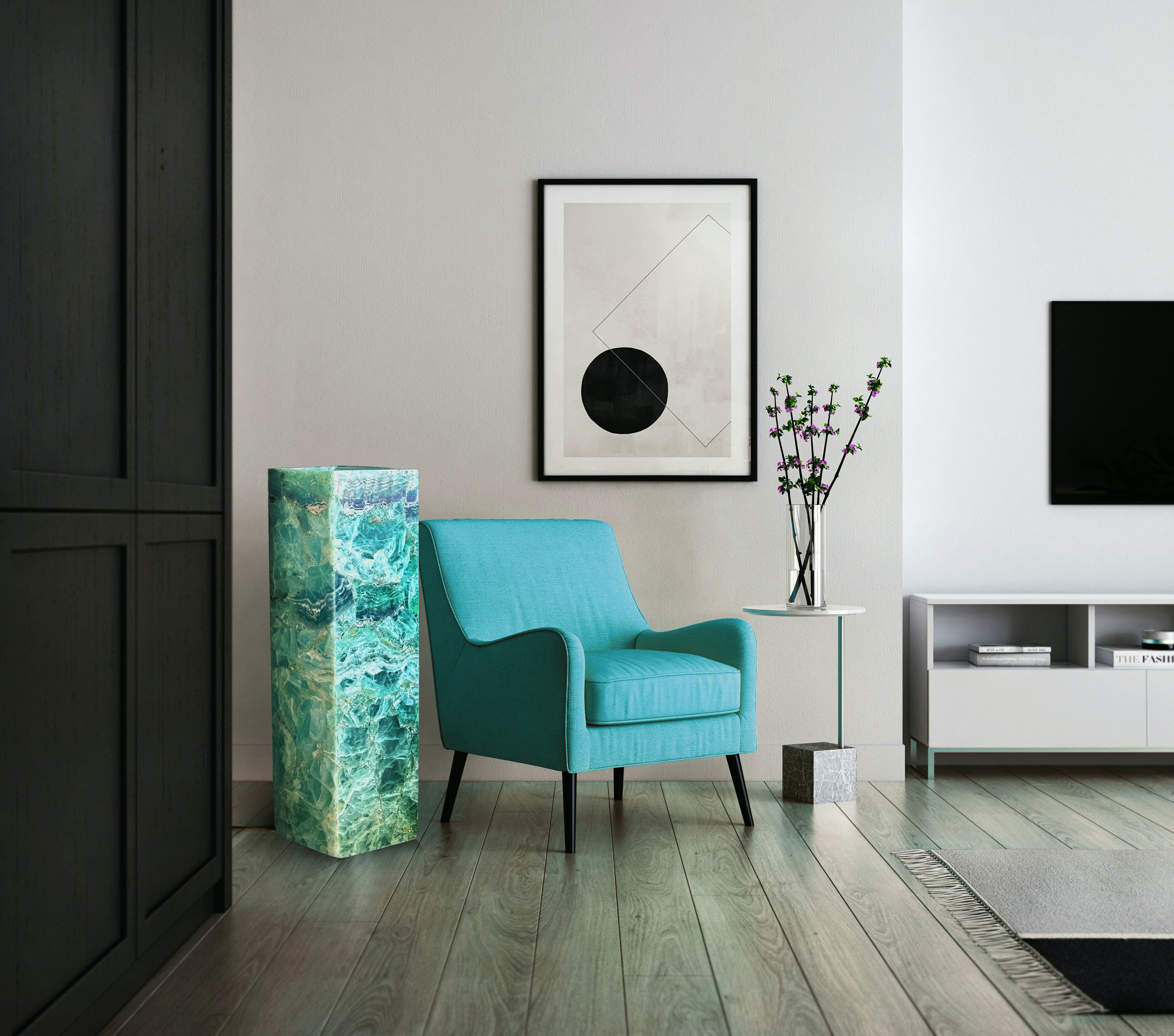 Rainbow fluorite floor lamp next to a teal couch in a modern minimalistic decor. Floor is wood and the walls are light colored with a soft texture.