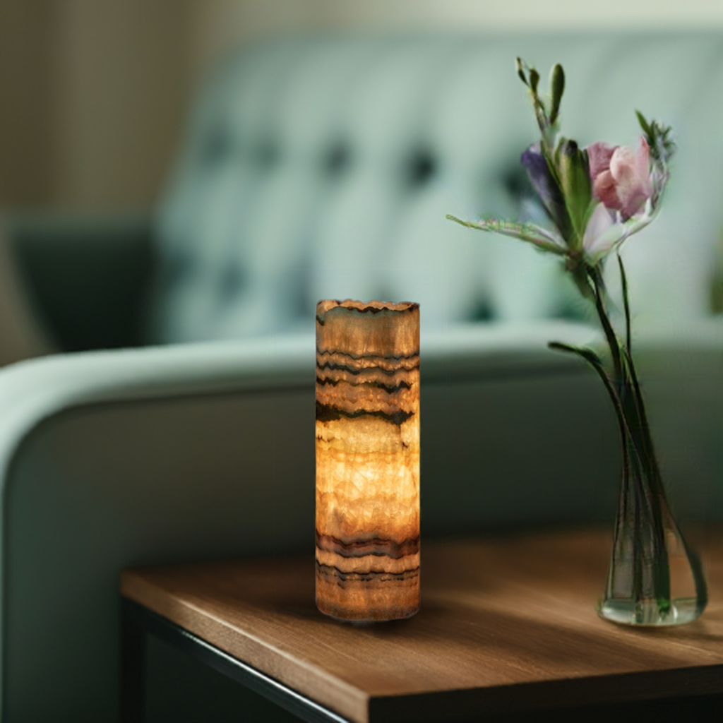 Desert onyx table lamp on side table next to green sofa