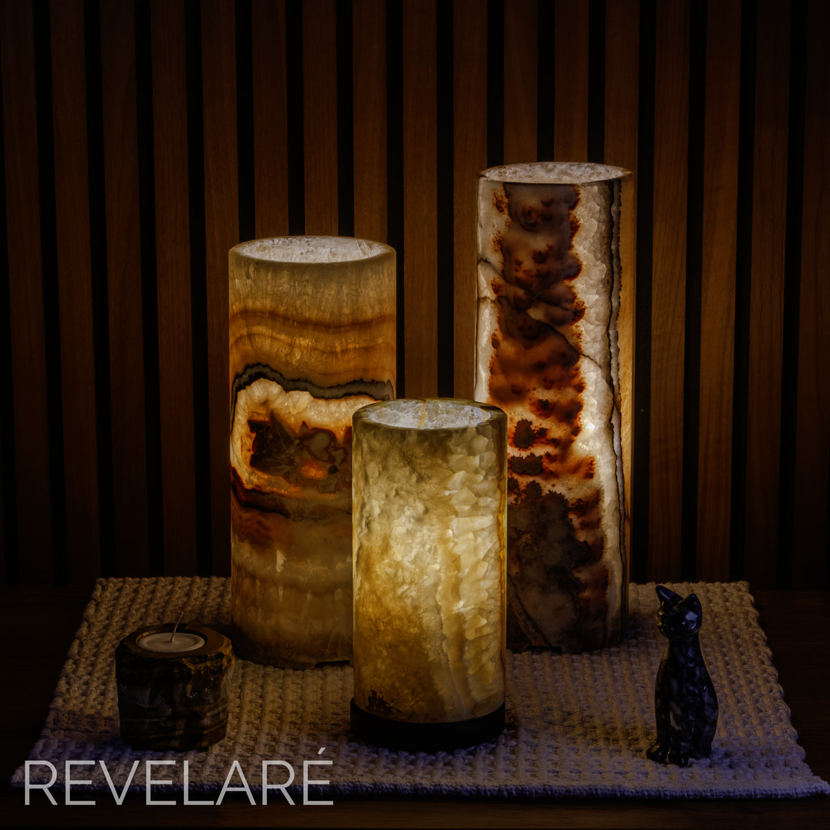 Desert pattern calcite lamps as seen when lit in a dark room. Comparison of available sizes.