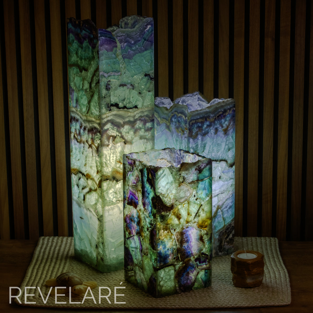 Fluorite square live edge lamps as seen when lit in a dark environment. Comparison of available sizes.